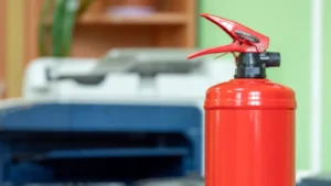 Fire extinguisher in a Texas office for workplace safety compliance